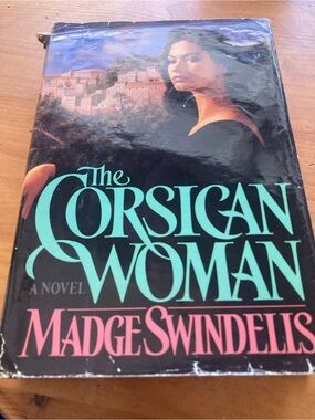 The Corsican Woman by Madge Swindells - Black Cover with Teal & Pink Text
